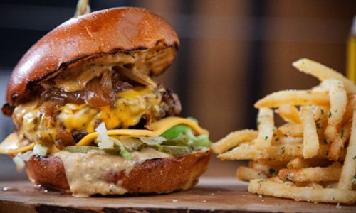 fries and a cheese burger with caramelized onions