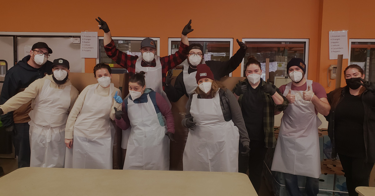 group photo of team from Captain Lawrence in aprons at Feeding Westchester